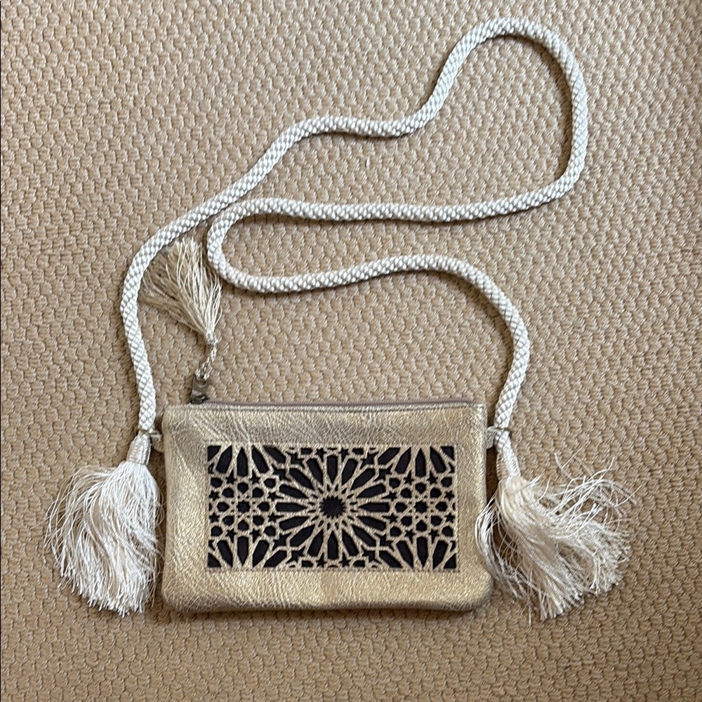 Elegant Beige and Black Clutch with Tassel Detail